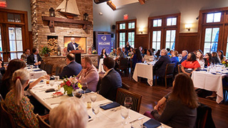 Dean Joseph J. Martinelli speaking at alumni reception.