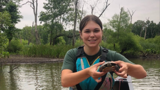 Eva Stumpf conducting fieldwork at the Lord Sterling Environmental Education Center