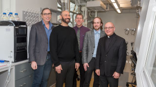 From left, Professors Stephen Kelty, Cosimo Antonacci, James Hanson, Gregory R. Wideman and Reverend Gerald Buonopane celebrate the arrival of the high-tech equipment.