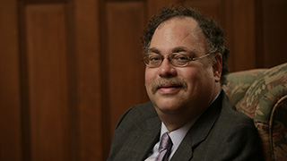 Headshot of Jon Radwan.Ruth TsuriaRabbi Alan Brill