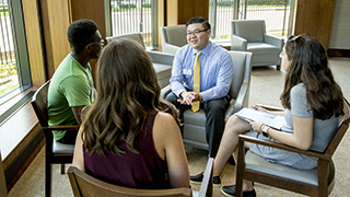Students talking to an admissions counselor.
