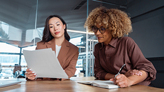 Adobe stock image of two people working