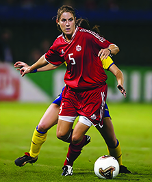 Andrea Neil with opponent on the soccer field.