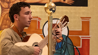 Bosco Budelman singing for Bishop's 2x2 Mass