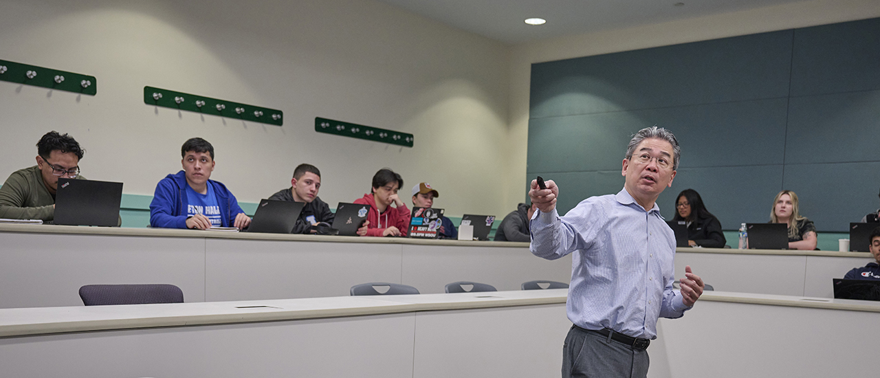 A professor teaching a class in the Stillman School of Business.