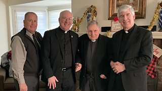 Monsignor Turro, with, from left Michael Burt, President Reilly and Monsignor McCarren.