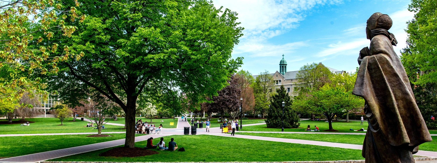 campus green with statue on the side