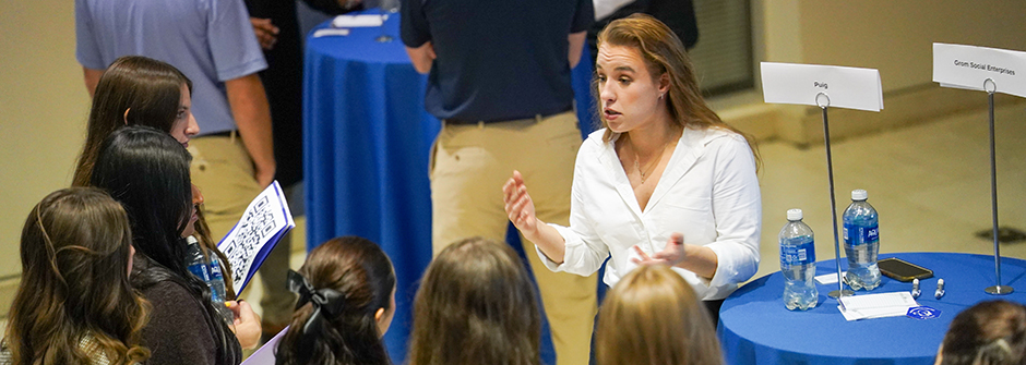 A speaker at the Career Fair speaking to students.
