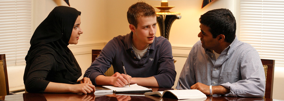 students talking in conference room