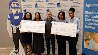 continuing-education with a check continuing-education participants holding a big check
