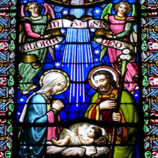 Image of the Nativity on stained glass. 