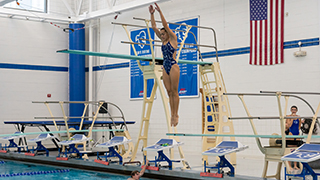 Athlete diving into an olympic pool