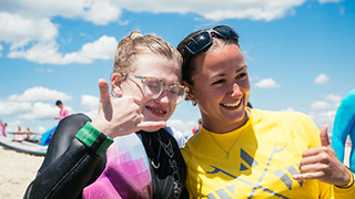 Seton Hall Doctor of Physical Therapy (DPT) student Domique Adornetto supports an athlete-participant during a A Walk on Water (AWOW) event.