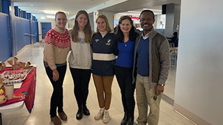 Professor Redwine, customers Alyssa Houseley and Amanda Grace, Prof. Enright, and Professor Alfani