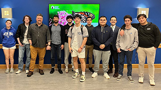 Seton Hall students and faculty with speaker David Mizejewski (third from left).