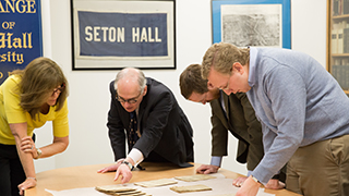 Faculty members doing research in the University archives