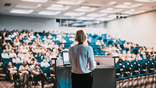 Female speaker facing audience