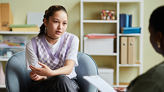 Female student in counseling talking to a professional