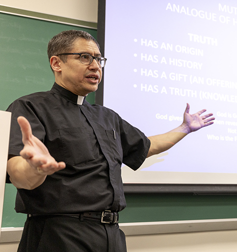 Fr. Ortiz Teaching Fr. Ortiz teaching a class at Seton Hall.
