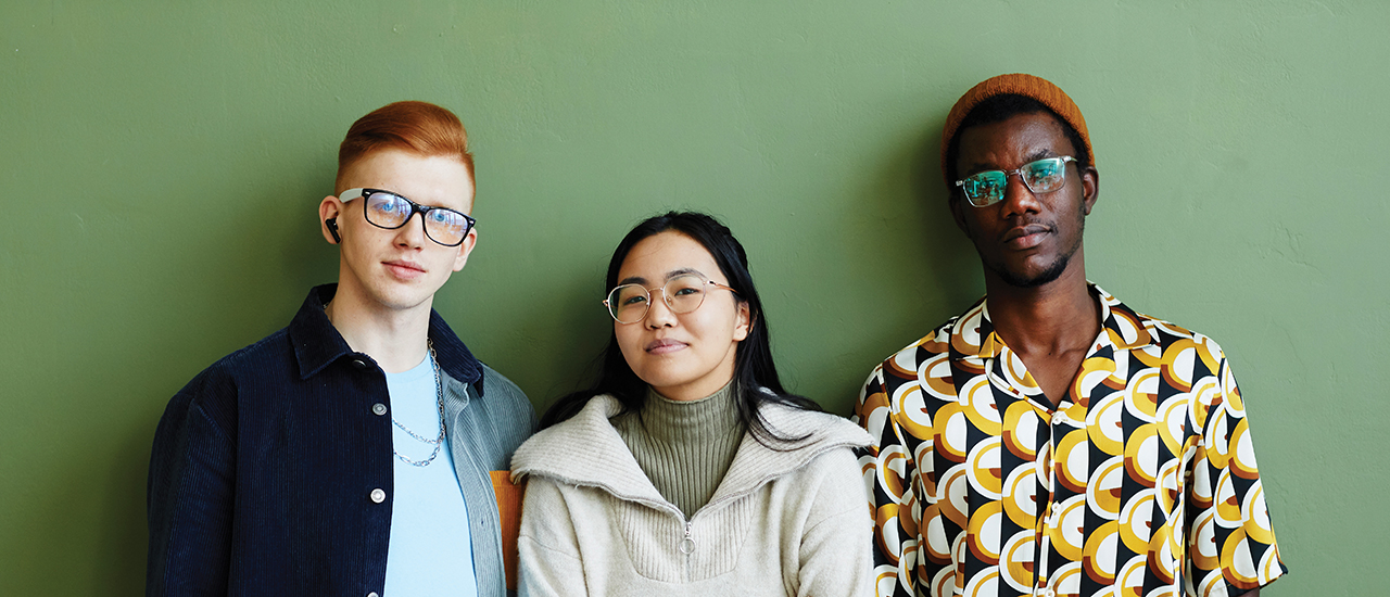 3 Diverse Gen Z workforce Posing with a green background.