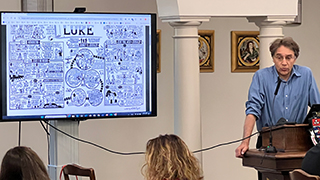 Glazov lecturing in front of the participants