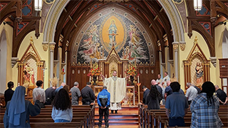 Father Nick giving Mass