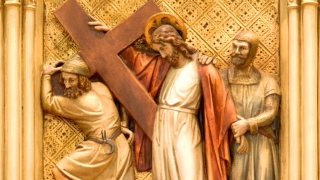 Simon of Cyrene helps Jesus carry the Cross