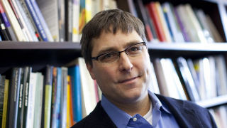 Headshot of Dr. Sean Kelly in his office