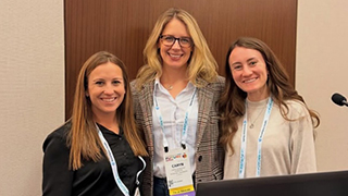 students and faculty at a conference