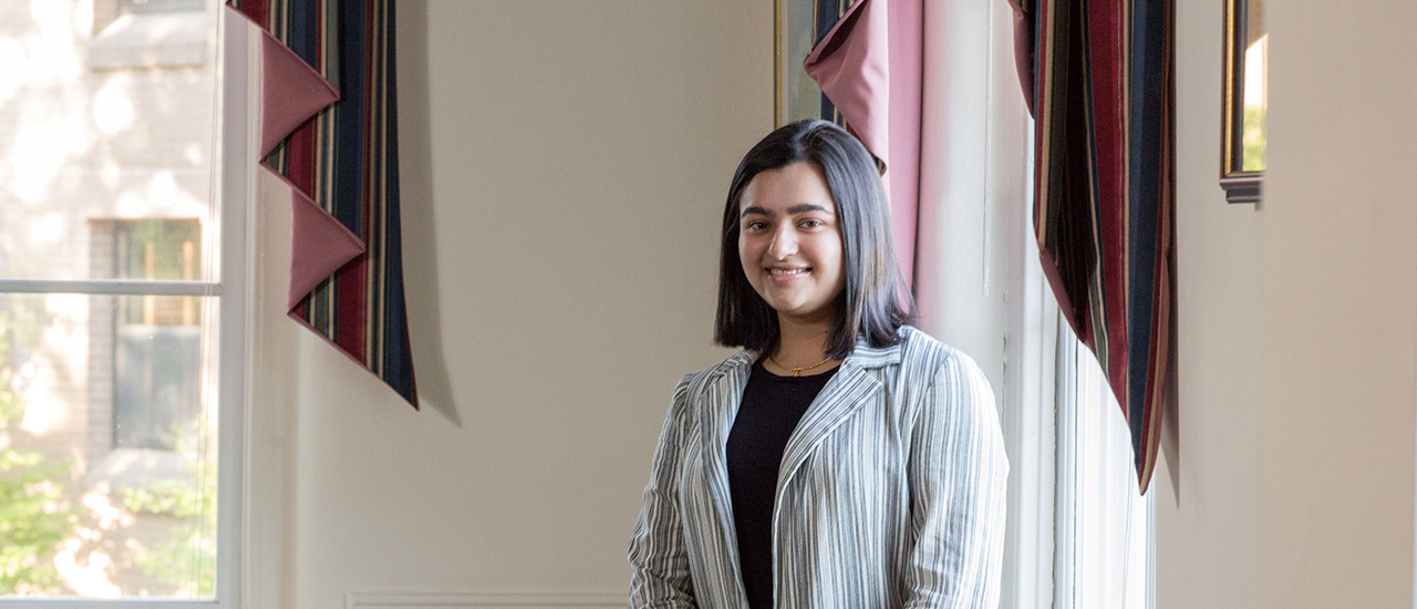 Diplomacy undergraduate student posing near a window.