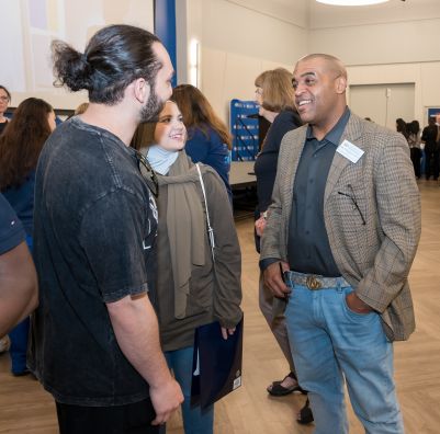 A photo of SHU professor speaking with students