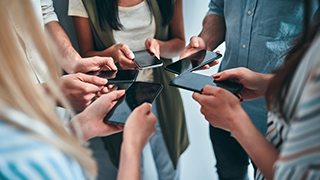 A group of students using mobile phones