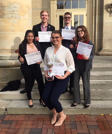 Model UN students posing with their awards at the Cornell Collegiate MUN Conference.