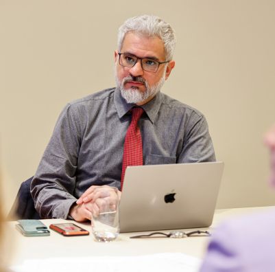SHU International Affairs Professor Sitting at a Conference