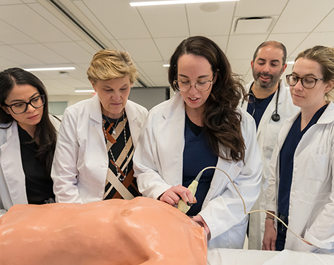 Students and faculty in the SIM lab.