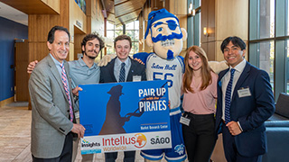 Students pose for a photo at Pair Up with the Pirates