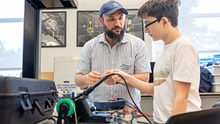 Pre-college student with professor