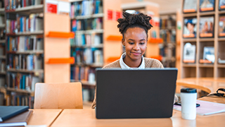 Woman submitting a request on a laptop Woman submitting a request on a laptop