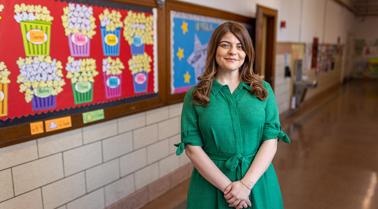 A secondary teacher posing at her school.