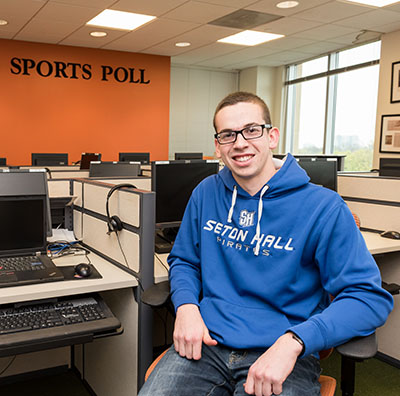 Business student at a Sports Polling Center workstation