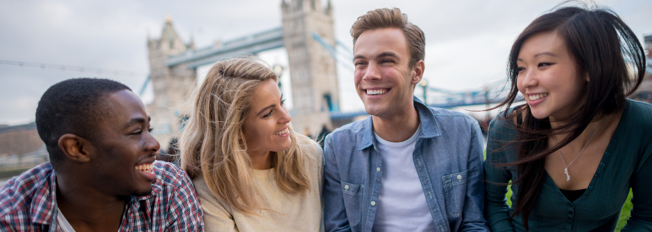 Young adults in front of London Bridge 