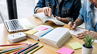 Students studying with books on the table.