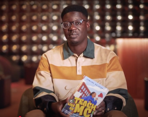 SHU professor holding book