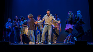 Students performing on stage